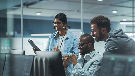 Three cybersecurity analysts working together