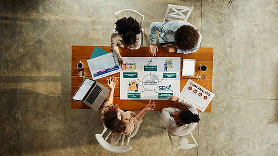 a photo of a student on a table studying 