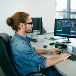 IT support working on his computer