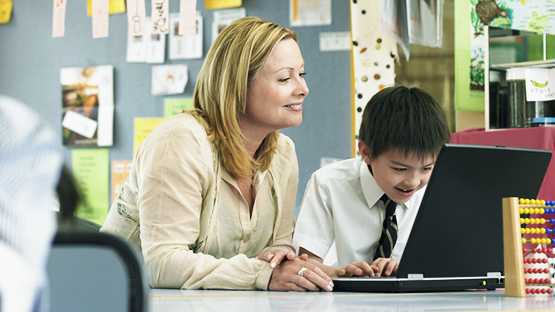 Professor working with young student