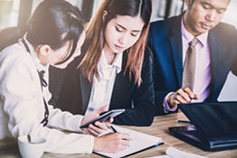 Employees working at a desk