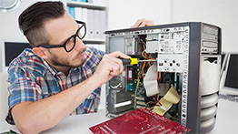 Technician working on a computer tower