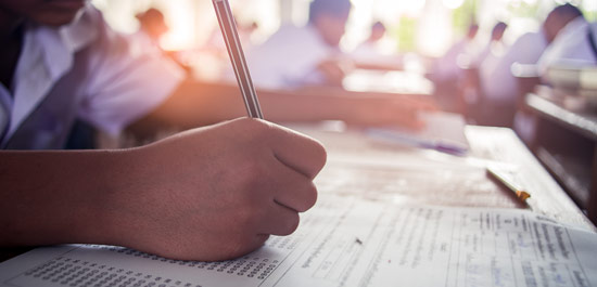 Closeup of a person writing with a pen