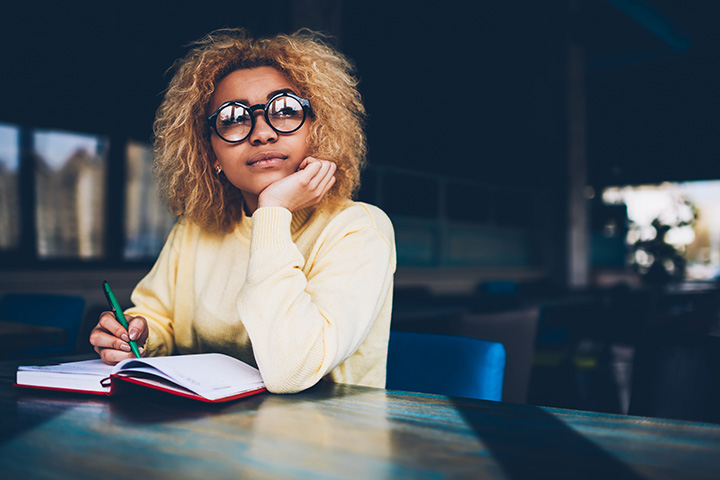 student reading on a desk