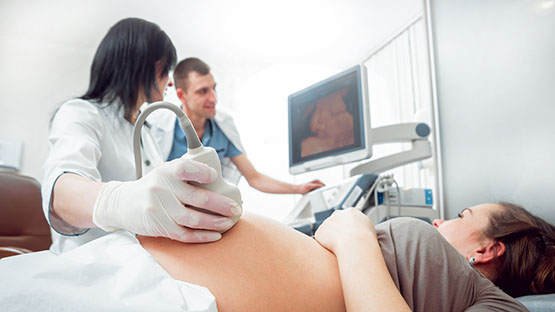 Diagnostic medical sonographer obtaining diagnostic image from patient